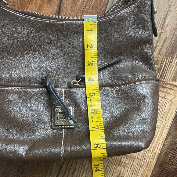 Dooney and Bourke. Brown leather shoulder bag. Has interior stains. - Picture 13 of 14